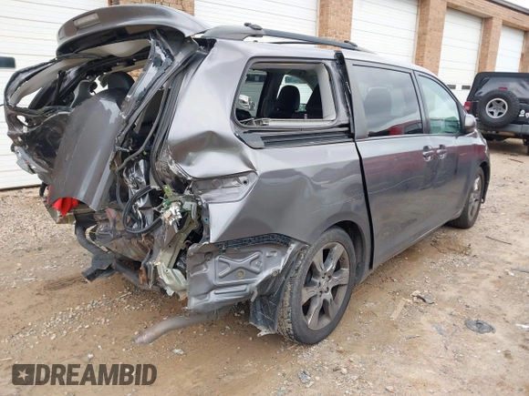 2012 Toyota Sienna SE with VIN 5TDXK3DC2CS235211, listed as a IAAI auction lot 42390354 with 242,602 mi miles and . Bid and sale history available at DreamBid. Image 4.