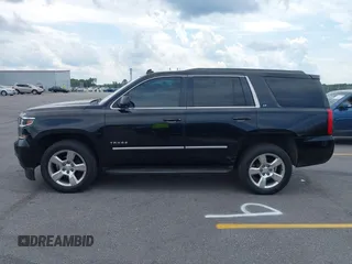 2015 Chevrolet Tahoe LT with VIN 1GNSCBKC4FR145119, listed as a IAAI auction lot 42309931 with 99,408 mi miles and . Bid and sale history available at DreamBid. Image 14.