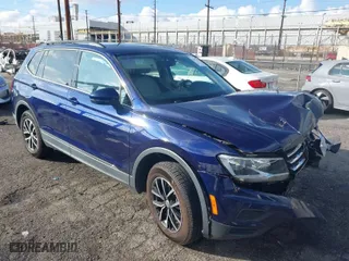 2021 Volkswagen Tiguan SE with VIN 3VV3B7AX9MM051125, listed as a IAAI auction lot 41527014 with 68,847 mi miles. Bid and sale history available at carsss.com. Image 1.