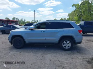2013 Jeep Grand Cherokee Laredo with VIN 1C4RJEAG2DC517303, listed as a IAAI auction lot 42040405 with 222,952 mi miles. Bid and sale history available at carsss.com. Image 14.