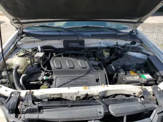 2003 Mazda Tribute LX with VIN 4F2CZ94133KM19916, listed as a Copart auction lot 73718284 with 151,644 mi miles and Salvage Title. Bid and sale history available at carsss.com. Image 12.