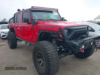 2020 Jeep Gladiator Rubicon with VIN 1C6JJTBG4LL178260, listed as a IAAI auction lot 42602460 with 61,899 mi miles and . Bid and sale history available at DreamBid. Image 1.