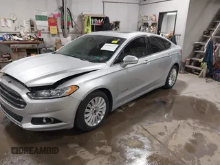 2014 Ford Fusion SE Hybrid with VIN 3FA6P0LU8ER183231, listed as a IAAI auction lot 41848377 with 130,496 mi miles. Bid and sale history available at carsss.com. Image 2.