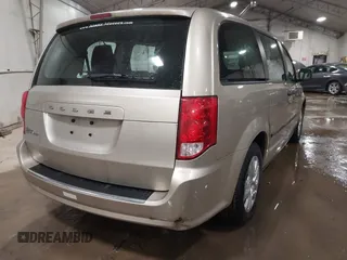 2015 Dodge Grand Caravan SE with VIN 2C4RDGBG2FR592899, listed as a IAAI auction lot 41309499 with 110,428 mi miles and . Bid and sale history available at DreamBid. Image 4.