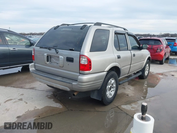 2004 Isuzu Rodeo S z VIN 4S2CK58W344311048, wystawiony jako IAAI lot #41472392 z przebiegiem 128 732 mil mil oraz . Historia ofert i sprzedaży dostępna na DreamBid. Obrazek 4.