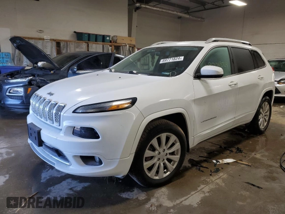 2018 Jeep Cherokee Overland z VIN 1C4PJMJX4JD614218, wystawiony jako Copart lot #69771824 z przebiegiem 59 695 mil mil oraz Szkoda całkowita • Salvage title. Historia ofert i sprzedaży dostępna na DreamBid. Obrazek 1.