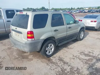 2005 Ford Escape XLT with VIN 1FMYU03145KA40360, listed as a IAAI auction lot 42511276 with 151,269 mi miles and . Bid and sale history available at DreamBid. Image 4.