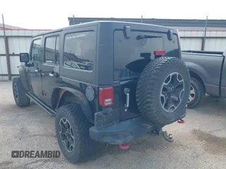 2015 Jeep Wrangler Unlimited Rubicon z VIN 1C4BJWFG2FL572417, wystawiony jako IAAI lot #41895927 z przebiegiem 54 981 mil mil oraz . Historia ofert i sprzedaży dostępna na DreamBid. Obrazek 3.