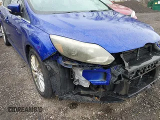 2014 Ford Focus Titanium with VIN 1FADP3J28EL240911, listed as a IAAI auction lot 42082812 with 144,625 mi miles. Bid and sale history available at carsss.com. Image 13.