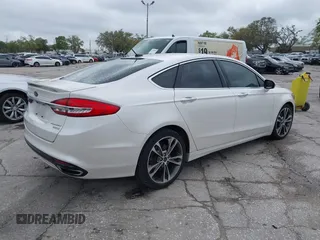 2017 Ford Fusion Titanium with VIN 3FA6P0K99HR272713, listed as a IAAI auction lot 41757334 with 104,733 mi miles. Bid and sale history available at carsss.com. Image 4.