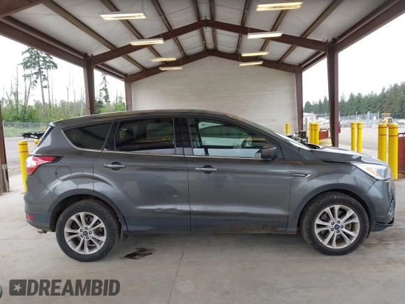 2017 Ford Escape SE z VIN 1FMCU9G93HUC97081, wystawiony jako IAAI lot #42327866 z przebiegiem 97 580 mil mil oraz . Historia ofert i sprzedaży dostępna na DreamBid. Obrazek 13.