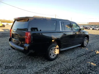 2015 Chevrolet Suburban LT with VIN 1GNSKJKC8FR180436, listed as a Copart auction lot 71109202 with 74,608 mi miles and . Bid and sale history available at DreamBid. Image 3.