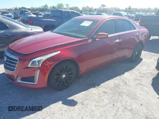 2016 Cadillac CTS Luxury Collection AWD with VIN 1G6AX5SXXG0100952, listed as a IAAI auction lot 41736200 with 123,495 mi miles and . Bid and sale history available at DreamBid. Image 2.