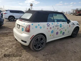 2010 MINI Convertible S with VIN WMWMS3C51ATZ85166, listed as a Copart auction lot 52907775 with 90,090 mi miles and Salvage title. Bid and sale history available at DreamBid. Image 3.