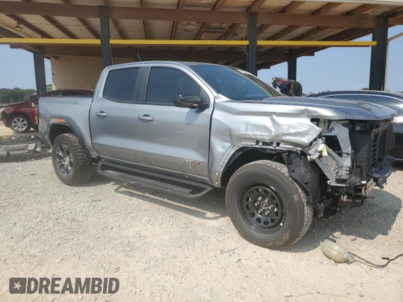 2024 GMC Canyon 4WD AT4 with VIN 1GTP6DEK9R1116173, listed as a Copart auction lot 71005134 with 5,298 mi miles and Salvage Title. Bid and sale history available at carsss.com. Image 4.