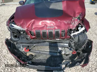 2020 Jeep Cherokee Trailhawk Elite z VIN 1C4PJMBN4LD549550, wystawiony jako Copart lot #64161064 z przebiegiem Nie podano mil oraz Szkoda całkowita • Salvage title. Historia ofert i sprzedaży dostępna na DreamBid. Obrazek 12.