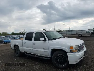 2005 GMC Sierra Denali z VIN 2GTEK63NX51184417, wystawiony jako Copart lot #55663955 z przebiegiem 201 401 mil mil oraz Tytuł czysty. Historia ofert i sprzedaży dostępna na DreamBid. Obrazek 4.