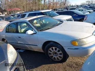 2001 Lincoln Continental with VIN 1LNHM97V71Y670611, listed as a IAAI auction lot 41385621 with 141,714 mi miles. Bid and sale history available at carsss.com. Image 1.