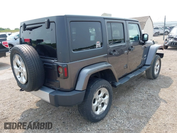 2014 Jeep Wrangler Unlimited Sahara with VIN 1C4BJWEG8EL285843, listed as a IAAI auction lot 42399090 with Not provided miles and . Bid and sale history available at DreamBid. Image 4.