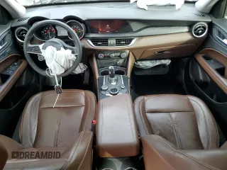 2019 Alfa Romeo Stelvio z VIN ZASPAJAN5K7C71665, wystawiony jako Copart lot #41913285 z przebiegiem 69 461 mil mil oraz Nie do naprawy. Historia ofert i sprzedaży dostępna na DreamBid. Obrazek 8.
