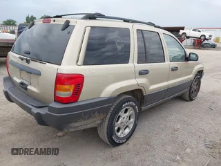 2001 Jeep Grand Cherokee Laredo with VIN 1J4GW48S51C566319, listed as a IAAI auction lot 42184875 with 148,471 mi miles and . Bid and sale history available at DreamBid. Image 4.