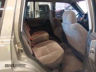 1996 Jeep Grand Cherokee Laredo with VIN 1J4GZ58S9TC293787, listed as a IAAI auction lot 41179368 with 141,755 mi miles. Bid and sale history available at carsss.com. Image 8.