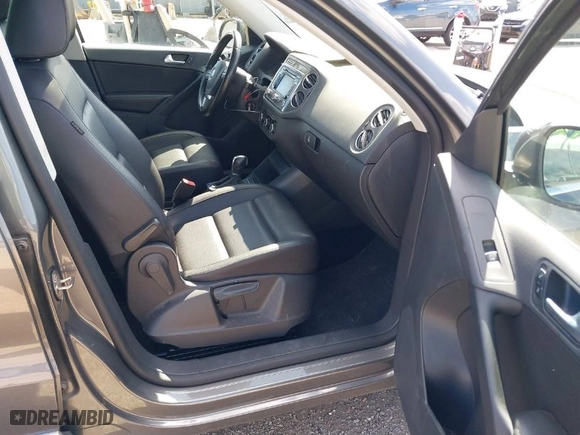 2012 Volkswagen Tiguan SE w/Sunroof & Nav with VIN WVGBV7AX4CW000207, listed as a IAAI auction lot 41889815 with 138,669 mi miles. Bid and sale history available at carsss.com. Image 5.