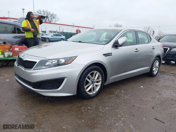 2011 Kia Optima LX with VIN KNAGM4A76B5146718, listed as a IAAI auction lot 42006225 with 213,939 mi miles. Bid and sale history available at carsss.com. Image 2.