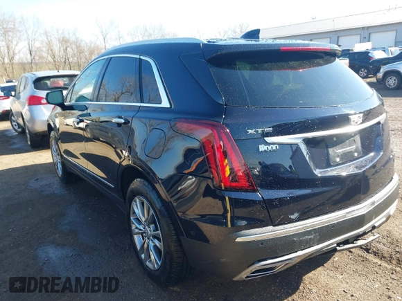 2021 Cadillac XT5 FWD Premium Luxury z VIN 1GYKNCRS2MZ141440, wystawiony jako IAAI lot #41874409 z przebiegiem 76 911 mil mil oraz . Historia ofert i sprzedaży dostępna na DreamBid. Obrazek 3.