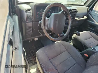 2001 Jeep Wrangler Sport with VIN 1J4FA49S21P374356, listed as a Copart auction lot 63568695 with 202,853 mi miles and Clean title. Bid and sale history available at DreamBid. Image 8.