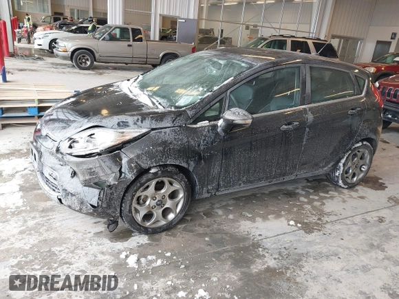 2011 Ford Fiesta SES with VIN 3FADP4FJ7BM196559, listed as a IAAI auction lot 41527976 with 65,861 mi miles. Bid and sale history available at carsss.com. Image 2.