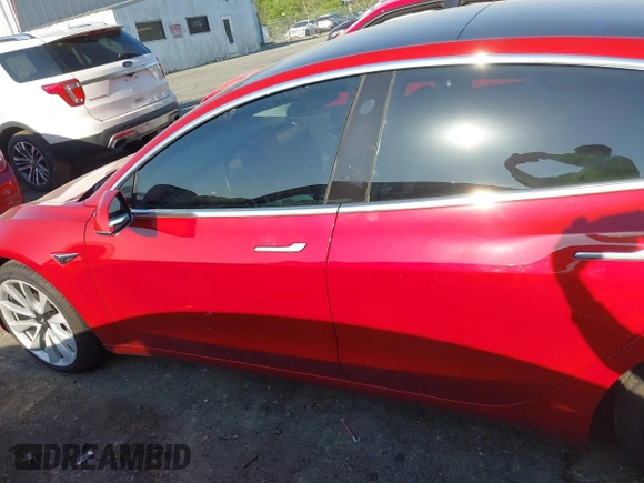 2018 Tesla Model 3 Long Range Battery with VIN 5YJ3E1EA5JF063555, listed as a IAAI auction lot 42028785 with 45,346 mi miles and . Bid and sale history available at DreamBid. Image 14.