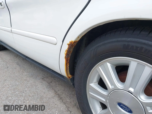 2005 Ford Taurus SEL with VIN 1FAFP56U55A249477, listed as a IAAI auction lot 42179970 with 174,398 mi miles and . Bid and sale history available at DreamBid. Image 14.