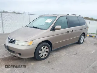 2004 Honda Odyssey EX-L with VIN 5FNRL18744B034830, listed as a IAAI auction lot 42052008 with 182,178 mi miles and . Bid and sale history available at DreamBid. Image 2.