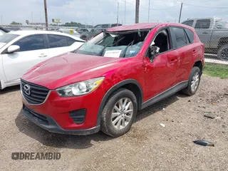 2016 Mazda CX-5 Sport with VIN JM3KE2BYXG0668401, listed as a IAAI auction lot 42370910 with Not provided miles and . Bid and sale history available at DreamBid. Image 18.
