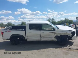 2019 Toyota Tacoma SR z VIN 3TMCZ5AN5KM249582, wystawiony jako IAAI lot #41925752 z przebiegiem 108 417 mil mil oraz . Historia ofert i sprzedaży dostępna na DreamBid. Obrazek 14.