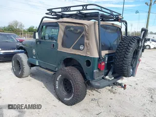 2000 Jeep Wrangler Sahara with VIN 1J4FA59SXYP743190, listed as a IAAI auction lot 41699142 with 1 mi miles. Bid and sale history available at carsss.com. Image 3.
