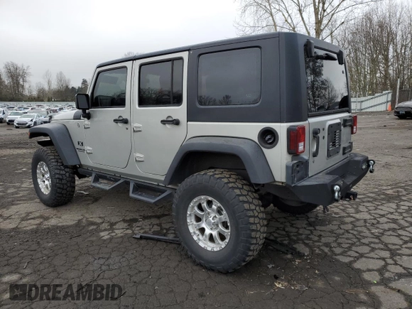 2007 Jeep Wrangler Unlimited X with VIN 1J4GA39177L105582, listed as a Copart auction lot 88912935 with 156,156 mi miles and Salvage Title. Bid and sale history available at DreamBid. Image 2.