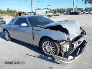 2004 Ford Thunderbird Deluxe with VIN 1FAHP60A84Y100984, listed as a IAAI auction lot 40978553 with 113,051 mi miles. Bid and sale history available at carsss.com. Image 1.