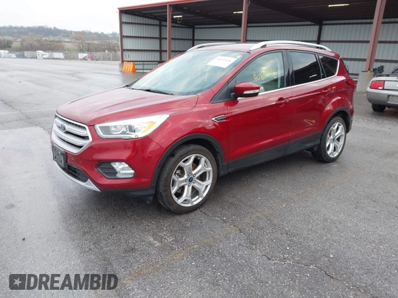 2019 Ford Escape Titanium z VIN 1FMCU9J99KUA18880, wystawiony jako IAAI lot #40830436 z przebiegiem 117 499 mil mil oraz . Historia ofert i sprzedaży dostępna na DreamBid. Obrazek 2.