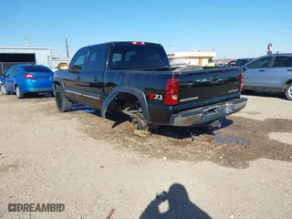 2005 Chevrolet Silverado 1500 LS with VIN 2GCEK13T551184097, listed as a IAAI auction lot 41598653 with 218,461 mi miles. Bid and sale history available at carsss.com. Image 3.