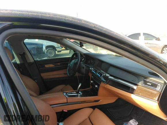 2011 BMW 7 Series 740i with VIN WBAKA4C55BC612634, listed as a IAAI auction lot 35404385 with 156,003 mi miles. Bid and sale history available at carsss.com. Image 5.