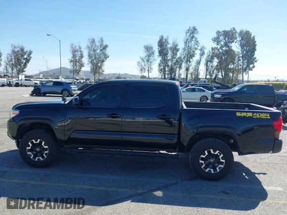 2018 Toyota Tacoma SR with VIN 3TMCZ5AN2JM127244, listed as a IAAI auction lot 41698199 with 61,535 mi miles and . Bid and sale history available at DreamBid. Image 14.