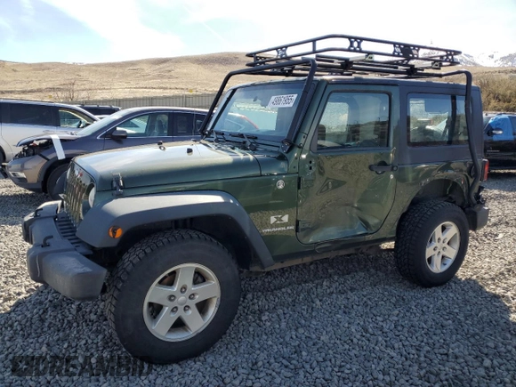 2009 Jeep Wrangler X with VIN 1J4FA24169L707695, listed as a Copart auction lot 49861955 with 89,807 mi miles and Salvage Title. Bid and sale history available at DreamBid. Image 1.