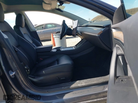 2023 Tesla Model 3 with VIN 5YJ3E1EAXPF652089, listed as a IAAI auction lot 42666520 with 17,679 mi miles and . Bid and sale history available at DreamBid. Image 5.