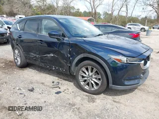 2021 Mazda CX-5 Grand Touring with VIN JM3KFBDM8M0484383, listed as a IAAI auction lot 41800786 with 58,617 mi miles. Bid and sale history available at carsss.com. Image 1.