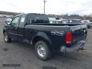 2000 Ford F-150 XL with VIN 1FTRX18WXYNC25817, listed as a IAAI auction lot 41976618 with 148,794 mi miles. Bid and sale history available at carsss.com. Image 3.