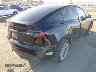 2023 Tesla Model Y Long Range z VIN 7SAYGAEEXPF673871, wystawiony jako IAAI lot #41980174 z przebiegiem 45 870 mil mil oraz . Historia ofert i sprzedaży dostępna na DreamBid. Obrazek 4.