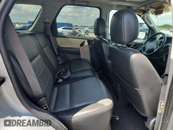 2003 Ford Escape XLT Popular with VIN 1FMYU03103KA06199, listed as a Copart auction lot 58731515 with 181,429 mi miles and Salvage title. Bid and sale history available at DreamBid. Image 11.