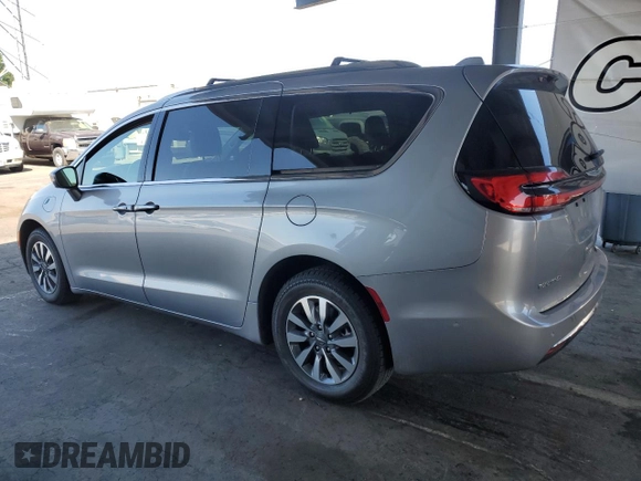 2021 Chrysler Pacifica Hybrid Touring L with VIN 2C4RC1L7XMR593911, listed as a Copart auction lot 57842415 with 74,910 mi miles and Salvage title. Bid and sale history available at DreamBid. Image 2.
